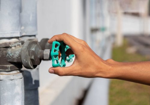 male hand opens the garden water tap, pouring clean fresh water water tap, turn on tap,Hands-off water