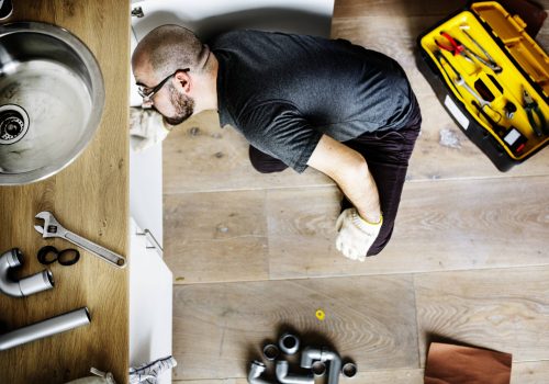 Man fixing kitchen sink